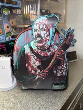 Terrifier Loungefly Art the Clown Blood Splatter GITD Mini Backpack EE Exclusive